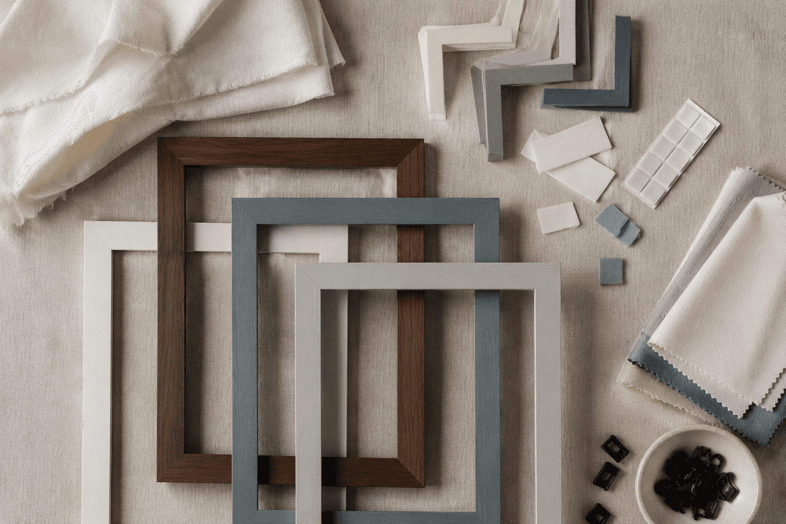 Flat lay of framing basics, spacers, cloths and clips